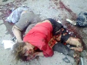 A woman is literally blown apart by a artillery shell in Lugansk, fired by the Ukrainian Army (2014) into a civilian enclave near the Russian border with Ukraine. She died a short time later... 