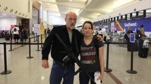 Mr. Cooley at the airport in Georgia to pick up his daughter with a AR-15 rifle. 