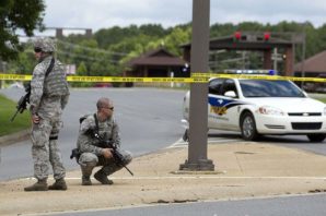 US Military personnel guard the front gate of Little Rock Air Force Base after a man tried to breach security. 