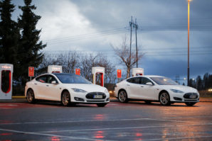 Two Tesla Model S Cars Plugged In At Supercharger Station