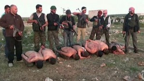 US backed Syrian Rebels executing bound prisoners in violation of the Geneva Convention. 