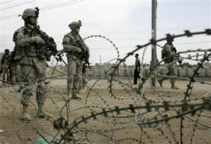 Soldiers stand guard to ward off attacks by protesters in Afghanistan. 