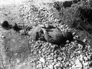 American military troops were starved, beaten, and tortured by their Korean and Chinese captors. Every rule set forth in the Geneva Convention was broken when thousands of Americans died at the hands of barbaric Communists in the Korean War. Pictured here: American prisoner of War in Korea brutally executed by North Korean soldiers and left to rot on the ground to be picked at by crows and insects. Note his hands were bound behind his back at the time. 