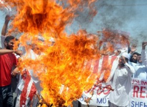 Thousands of Pakistani protesters burn the American flag and shout anti-American slogans during a recent demonstration in Islamabad. 