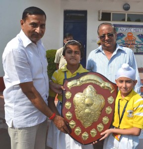 Minister with Chairman JK Public School and students. 