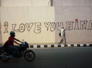 People walking down the Graffiti 