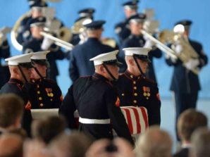 The flag draped coffin of Ambassador Stevens being carried by U.S. Marines Honor Guards. Stevens was brutally tortured, raped and murdered during the armed assault against the U.S. Diplomatic Mission in Benghazi Libya on the anniversary of the 9-11 attacks against America. Report suggests that security was "grossly inadequate." 