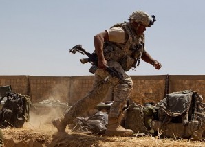 DUCKING BULLETS: U.S. Marines scrambles for cover under a hail of bullets from the enemy in Afghanistan 2013. 