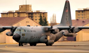 Giant C-130 Hercules  taxis to park on the east side of the flightline at Yokota Air Base - not far from Thursday failed attacks. 