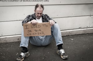 A man sits on the street homeless and without food in Louisiana begs for help by holding a sign appealing to people on the basis that he used to be your neighbor.  