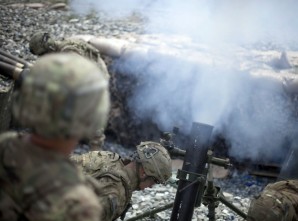 Soldiers pound an enemy position with 120 mm High Explosive mortar bomb mortars in Afghanistan. 