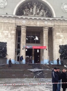 A photo taken on a cell phone, made available by Volgograd Mayor's Office, shows debris strewn about outside an entrance to Volgograd railway station, Sunday, Dec. 29, 2013 after a female suicide bomber detonated at least 10 kg of TNT strapped to her body. 