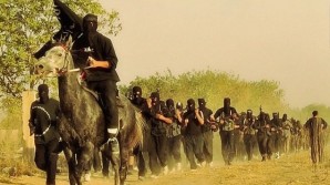 Photographs and intelligence information indicate that whenever there is pressure on armed groups in Syria, they withdraw to Iraq ... to regroup and then carry out terrorist operations in the two countries,” Askari said. Pictured here: Al-Qaeda affiliate Jabhat al-Nusra fighters in training in Iraq (photo credit: Wikicommons/File)