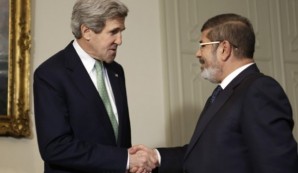 Kerry shakes hand of his "good friend" former President Morsi who was secretly in touch with al-Qaeda leader Ayman al- Zawahiri. 