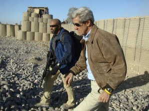 John Kerry with armed bodyguard assigned to his  Diplomatic Security detail. 