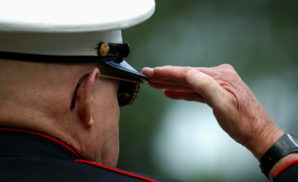 A U.S.M.C. retiree from Korea salutes during veterans day 2013. 