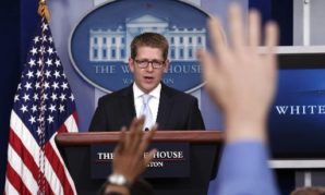 Jay Carney addresses "gaggle" of press reporters. 