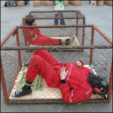 Guantanamo Bay prison camp had prisoners in cages like dogs. 