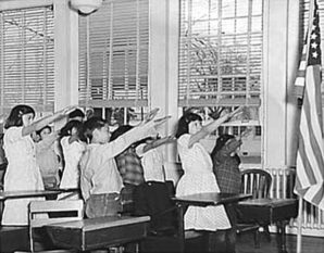 Oddly the proper way to salute the flag back in the day was arm extended. 
