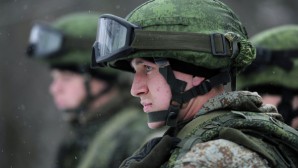 Russian naval infantrymen wait in staging area for mock assault on a beach. 