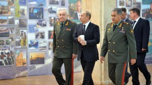 Russian Defense Minister Sergei Shoigu pictured here to the right of President Vladimir Putin discussed the situation of the military takeover of Crimea. 