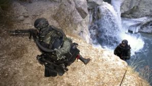 French commando unit makes incursion into enemy territory during military exercise in France. Members are with the French Foreign Legion. 