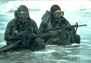 SEAL team members creep ashore during NATO combat exercise in North Atlantic in 2013. 