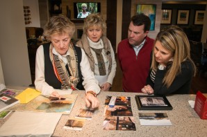 Judy Pitt, founder of the Kazi Yake Foundation, shares photos of Kenya villagers helped by the foundation's fresh water program with Taylor Morrison Denver's Kathy Curtis, VP Marketing and Sales Brian Cartwright and Marketing Manager Becky Hunt. 