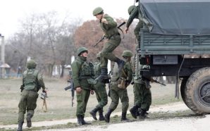 Russian troops deploy to positions surrounding a Ukrainian military base in Crimea. 