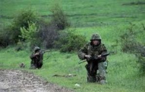 Russian soldiers creep on Chechen terrorists position. 