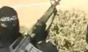 A US backed rebel holding a US made M-16 assault rifle in Syria. 