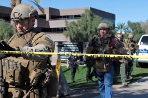 Phoenix Police officers in full military gear. Note officer in front has 4 X 30 round weapon clips not including the one in his assault weapon is over 120 rounds? Prepared for war!