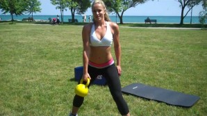 A woman using kettle bells to maintain weight