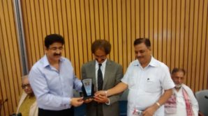 Awais Sheikh receiving momento