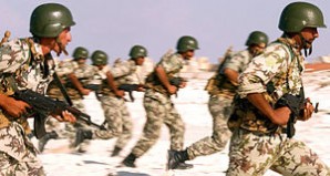 Egyptian army soldiers advance on a target during a military readiness exercise. 