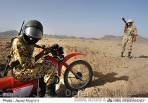 Iranian Army scout on motorcycle - part of an anti armor two man unit hunting ISIS fighters along the Iran/Iraq border. 