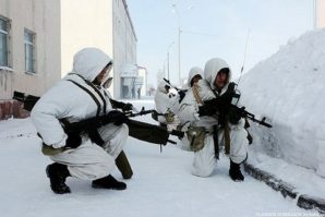 Russian airborne commando team gets ready to assault position after massive airborne drop in Arctic weather conditions.  