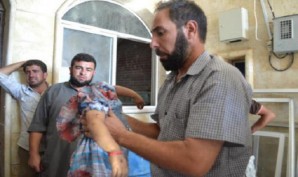 Unbelievable: Father holds headless corpse of child killed by Moderate Syrian rebels supported by the United States and your tax dollars? 