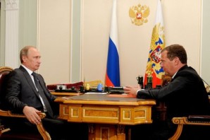 Putin with Medvedev meet to discuss proposed changes in governmental and defense structure. 