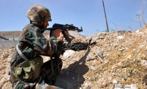 Syrian army soldier advances on terrorist targets near Damascus. 