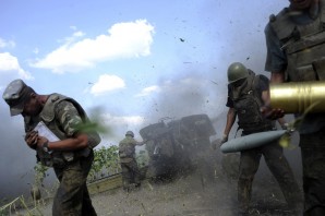 Ukrainian troops launch artillery strikes against pro Russian separatist forces. At least one civilian reported killed overnight.