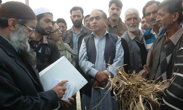 Minister for Agriculture,  Ghulam Hassan Mir with farmers & officers