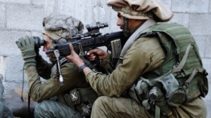 Elite Israeli infantry soldiers move into position against the enemy. 