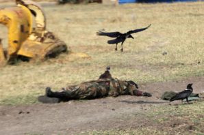 The body of a dead soldier lies on a street in Malakal, South Sudan. 2014