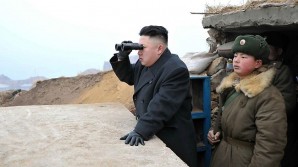 Kim Jung looks across the DMZ at American military emplacements 2014. 