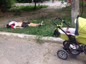 Woman has been heavily injured during bombing of Lugansk, Child survived. Blood on stroller #Ukraine  12:17 PM - 14 Jul 2014. Credit: Twitter  Nicolaj Gericke   