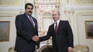 Russian President Vladimir Putin (R) welcomes his Venezuelan counterpart Nicolas Maduro before their meeting on January 15, 2014. 