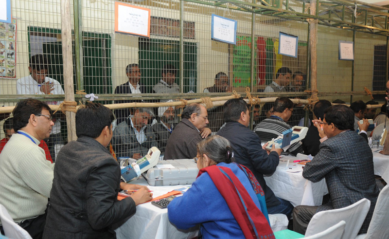 The Electoral officials counting votes for the Delhi Assembly Election, at a centre, in New Delhi on February 10, 2015.