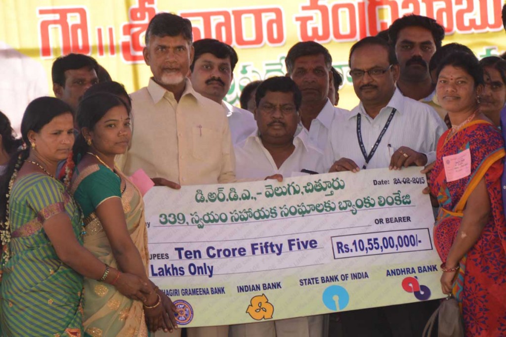 Chief Minister of Andhra Pradesh Mr. Nara Chandra Babu Naidu, distributing bank linkage documents to self-help groups in Shatipuram Mandal, Chittoor District on 24-02-2015. 