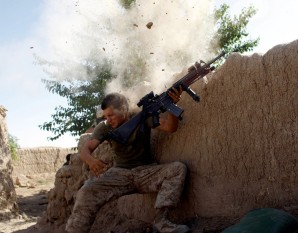 ON THE DEFENSIVE: Taliban fighters almost blow the head of this young Marine in Afghanistan.